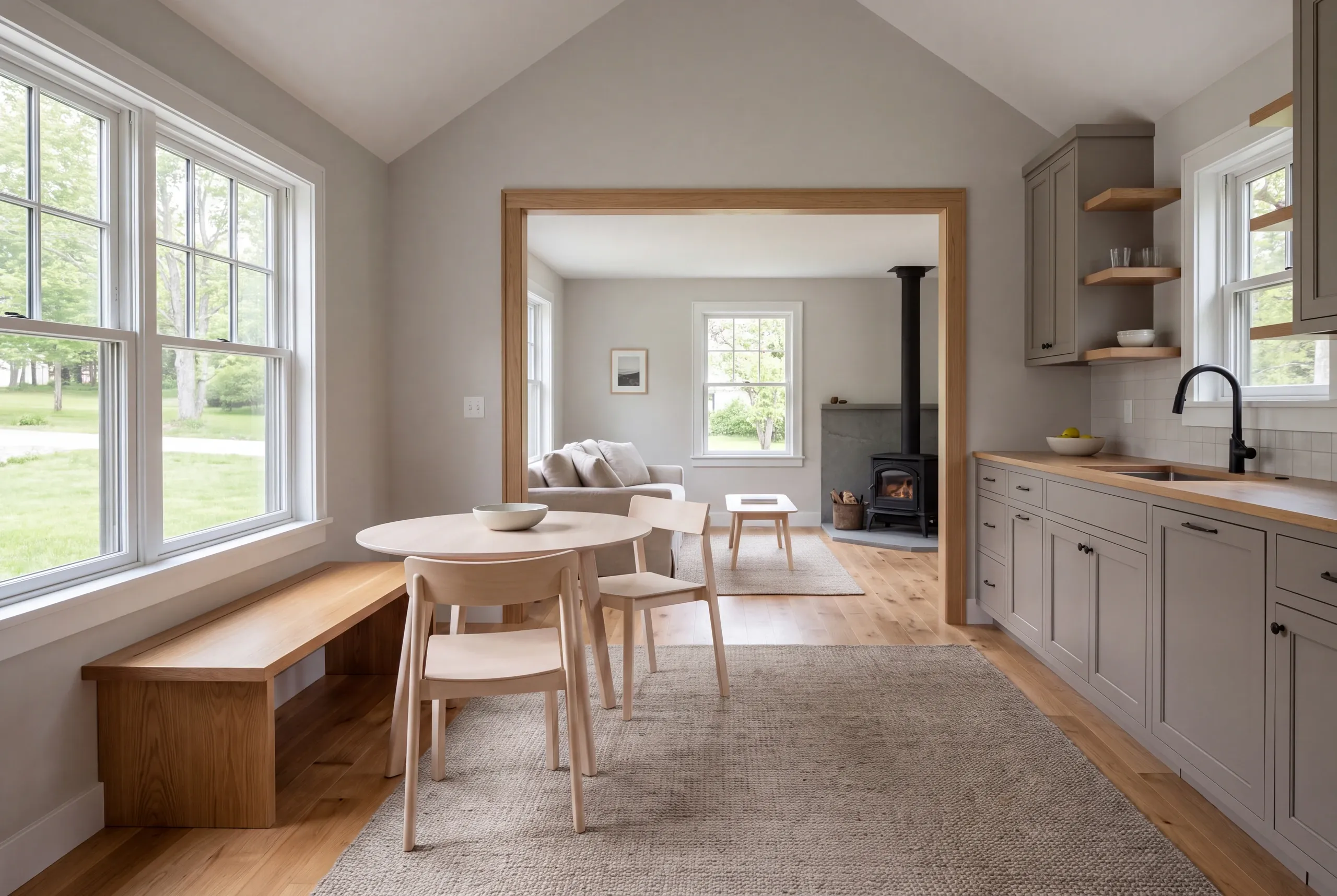 Interior view showing a finished connection between a kitchen, dining area, and living room.